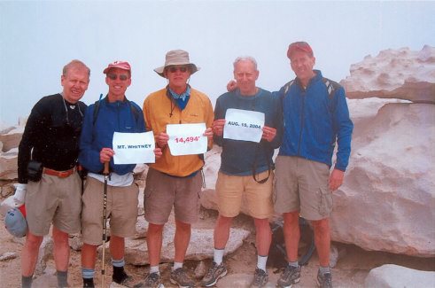 A handful of the Ridge Runners take in the view atop Mount Whitney in 2004, one of more than a dozen such trips made by members of the group. From left to right: Lynn Borland, Troy Elander, Frank Gibbons, Jon Varat and Ron Graham.
