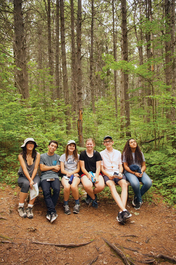 Taking a break along a trail in Algonquin Provincial Park are (left to right) Yuko Nakano, Greg Gladkov, Claire Dubin, Caroline Bamberger, Noah Alcus and Makayla Michelini. Photo: Steve Engelmann